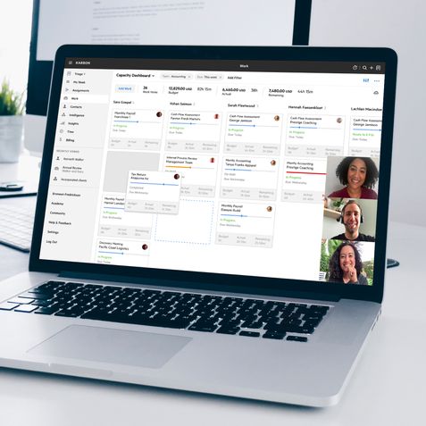 A laptop showing people on a Karbon training call.